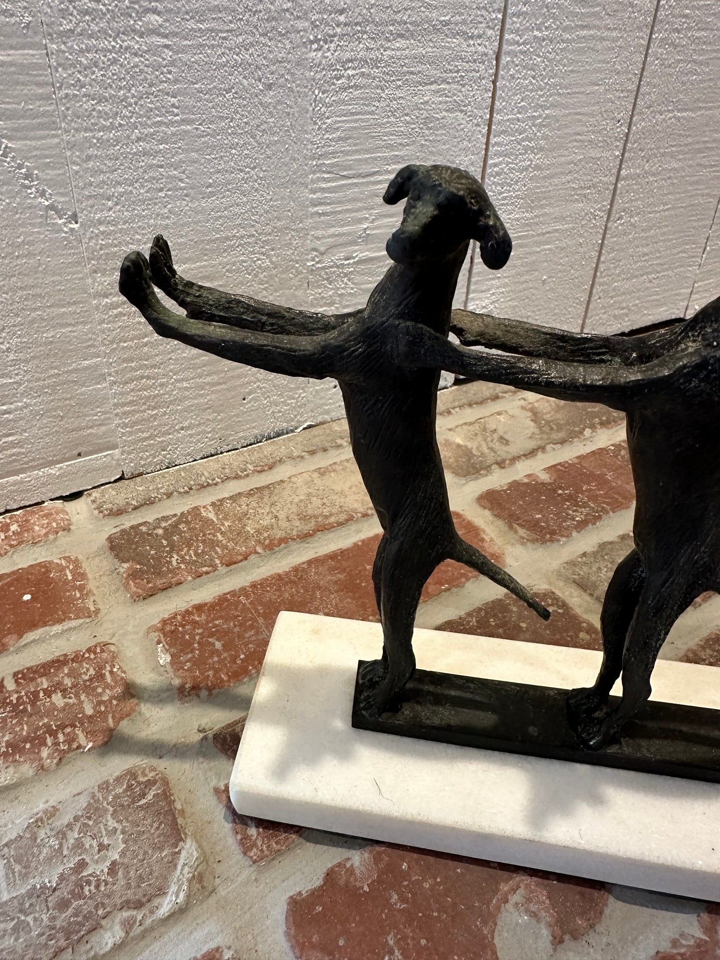 Conga Line Dog Sculpture